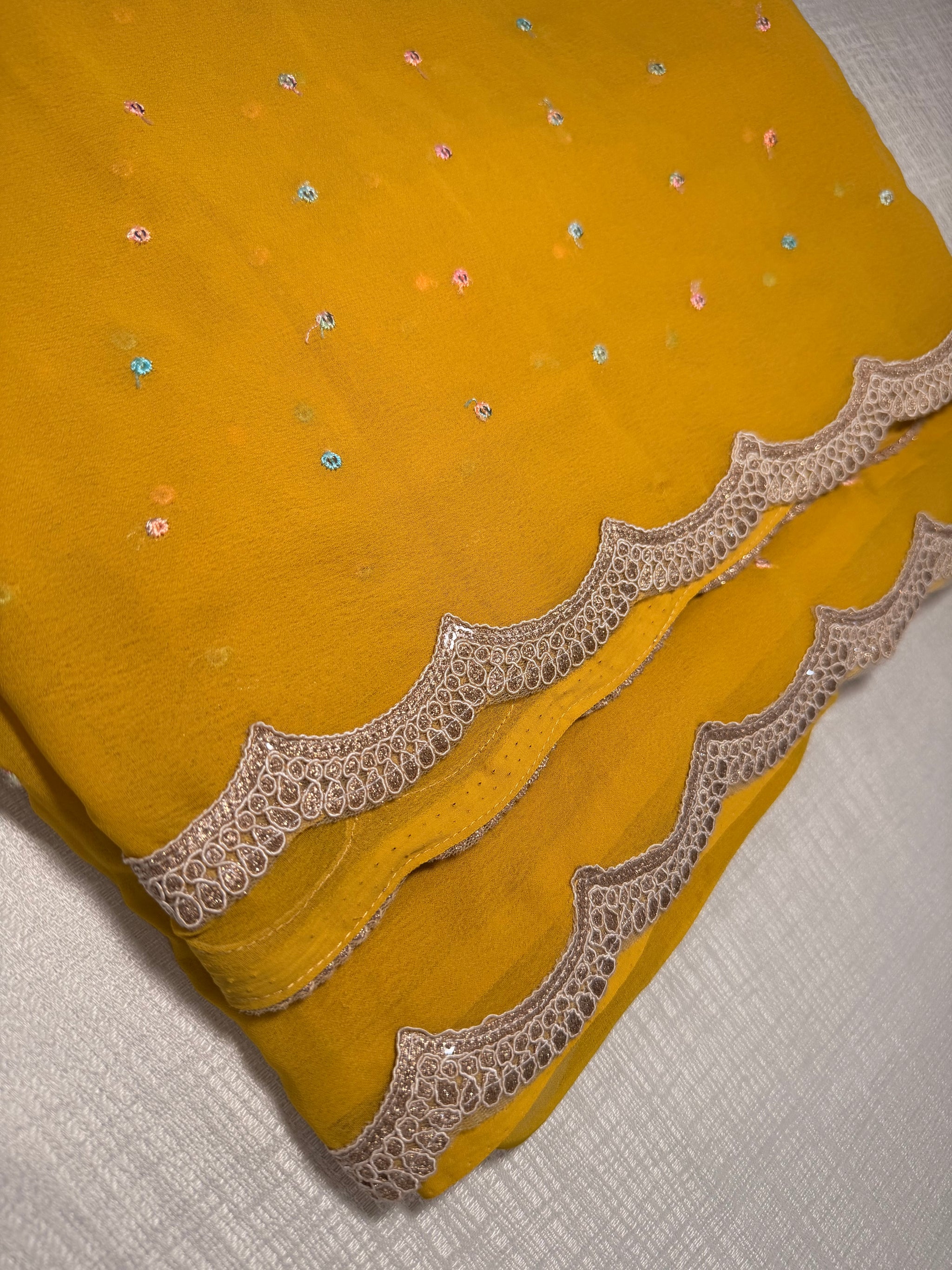 Mustard Georgette Saree — Scalloped Lace Border & Embroidered Buti
