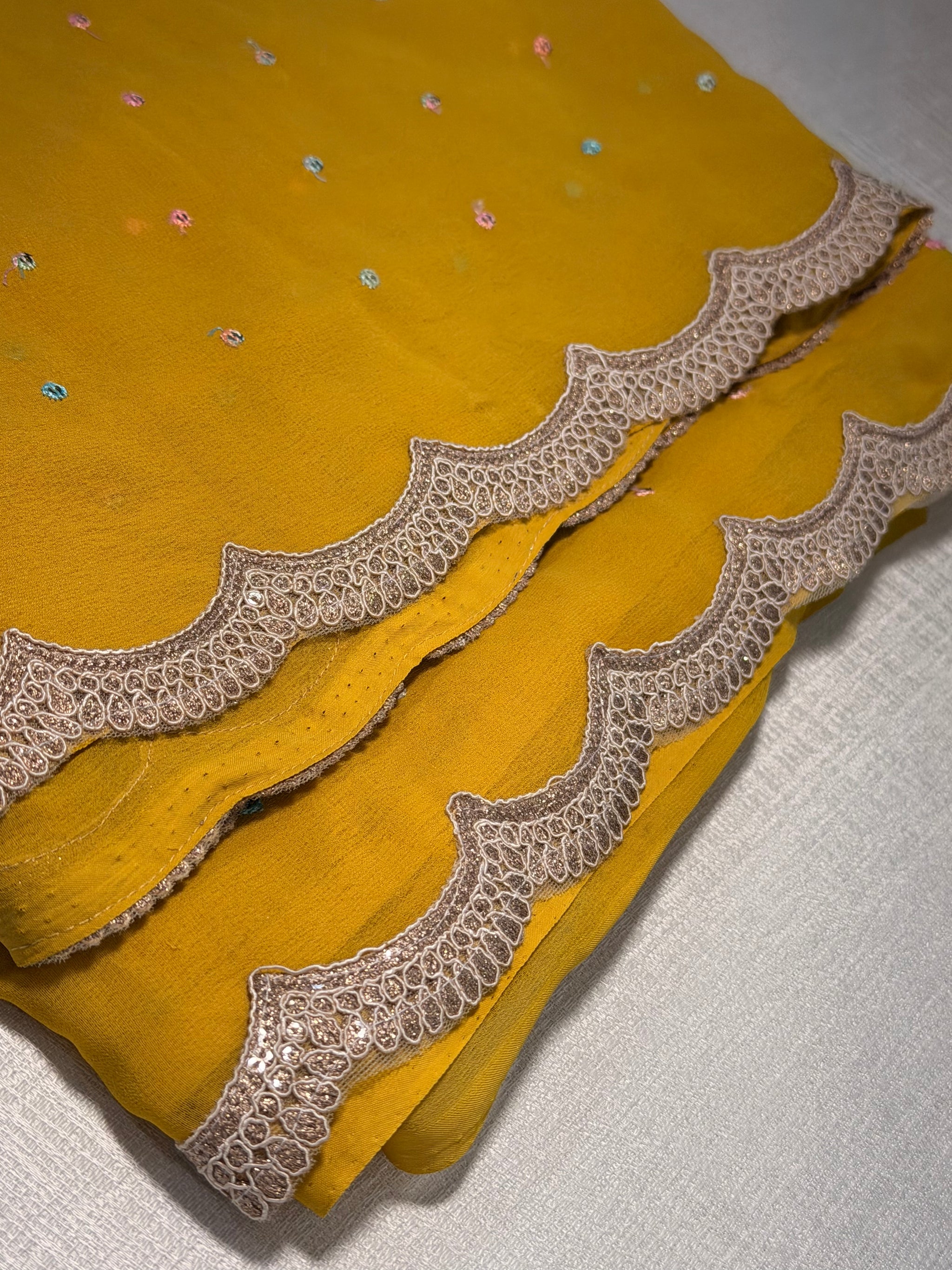 Mustard Georgette Saree — Scalloped Lace Border & Embroidered Buti