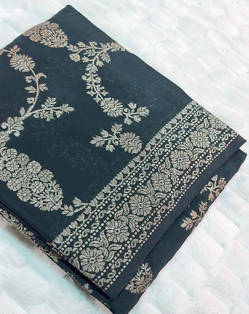Black Khaddi Crepe saree neatly folded, gold zari jaal weave with ornate pallu border