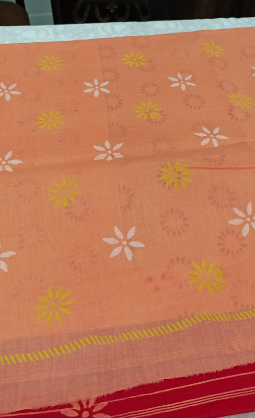 Coral red cotton block-print saree — full spread with pallu border